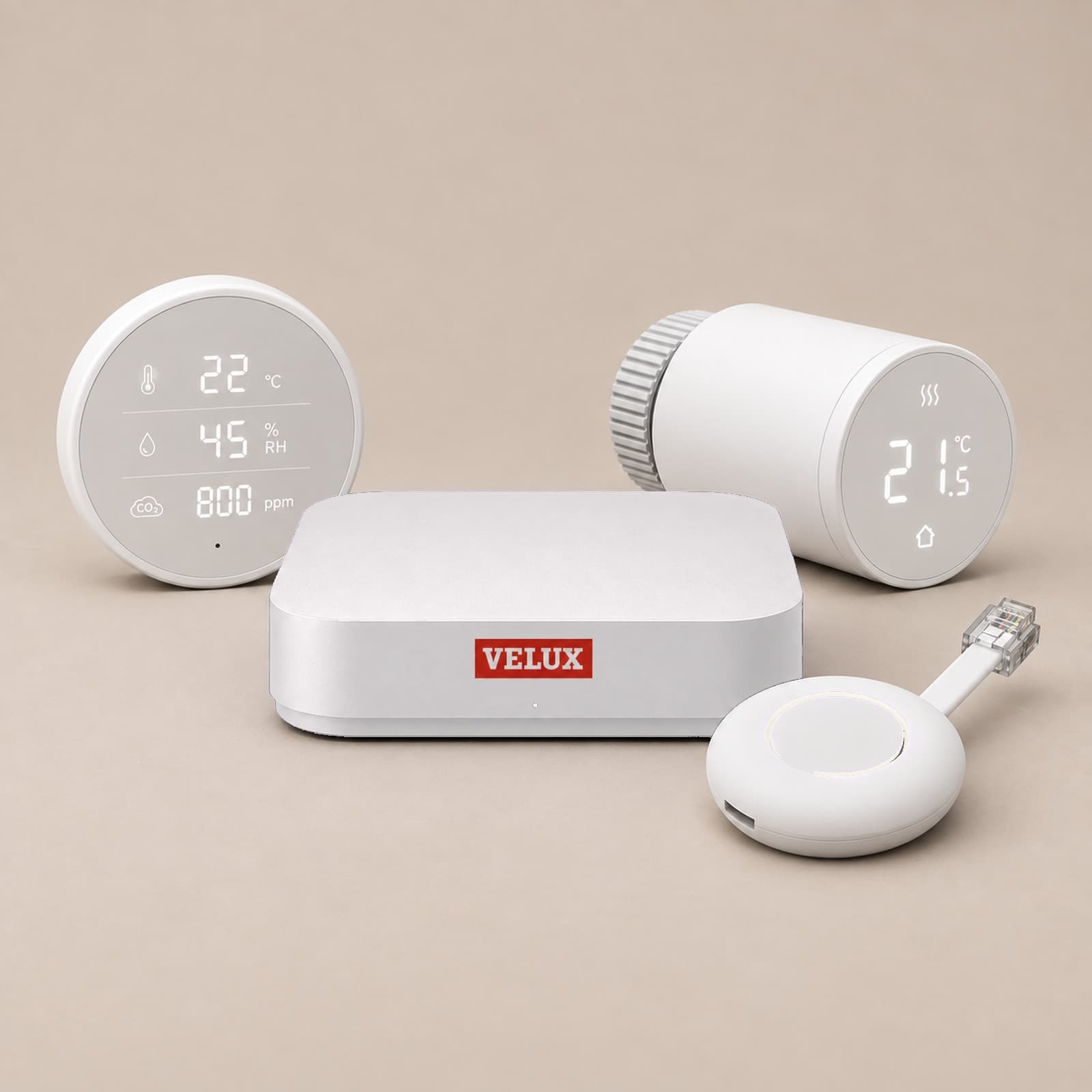 The SmartClimate hub, a round room sensor reading 22 °C, 45% humidity and 800 ppm, a radiator thermostat at 21.5 °C and the smart connector with its network plug.